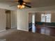 Living room with carpet that goes into a dining room with dark wood floors at 57 Kristina Ct, Acworth, GA 30101