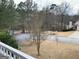 Scenic street view showcasing the home and surrounding natural landscape at 57 Kristina Ct, Acworth, GA 30101