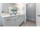 Modern bathroom with double vanity, stone countertops, sleek hardware, and tiled floors at 1492 Trellis Court (Lot 44), Hampton, GA 30228