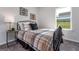 Cozy bedroom with large window and comfortable furnishings perfect for restful nights at 1492 Trellis Court (Lot 44), Hampton, GA 30228