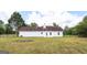 Large grassy backyard with a chain link fence at 153 Cedar Ridge Rd, Locust Grove, GA 30248