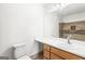 Neutral bathroom with white vanity, granite countertop and tile shower at 153 Cedar Ridge Rd, Locust Grove, GA 30248