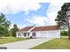 Well-maintained home with charming curb appeal and an attached garage at 153 Cedar Ridge Rd, Locust Grove, GA 30248