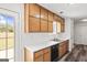 Well-equipped kitchen with wooden cabinets, laminate floors, and plenty of counter space at 153 Cedar Ridge Rd, Locust Grove, GA 30248