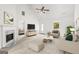 Bright living room with vaulted ceiling, fireplace, stylish furnishings and a large sunlit window at 153 Cedar Ridge Rd, Locust Grove, GA 30248