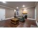 Cozy living room area with hardwood floors, wet bar, and neutral paint palette at 3030 Shallowford Park Mnr, Roswell, GA 30075