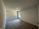 Bright bedroom featuring neutral walls, plush carpeting, and natural light from a single window at 1825 Harmony Trce # 6, Lithonia, GA 30058