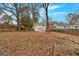 Spacious backyard with privacy fence, mature trees and an open lawn at 1222 Forrest, Atlanta, GA 30344