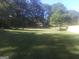 Large, open backyard offering endless possibilities for recreation or relaxation at 2421 Rockbridge Sw Rd, Stone Mountain, GA 30087