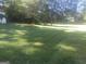 The property features a very large grassy area, ready for entertaining or relaxing at 2421 Rockbridge Sw Rd, Stone Mountain, GA 30087
