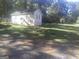 Charming single-story home with light siding and a well-maintained lawn in a peaceful, wooded setting at 2421 Rockbridge Sw Rd, Stone Mountain, GA 30087