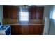 Functional kitchen with appliances, ample counter space, and wooden cabinets at 2421 Rockbridge Sw Rd, Stone Mountain, GA 30087