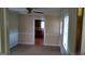 Inviting living room with neutral carpet and an opening to the kitchen at 2421 Rockbridge Sw Rd, Stone Mountain, GA 30087