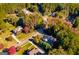 Aerial view of several homes in a wooded neighborhood at 101 Kenmare Row, Tyrone, GA 30290