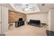 A basement features a wooden accent wall and carpet flooring at 101 Kenmare Row, Tyrone, GA 30290