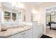 Bathroom with dual vanities, granite countertops, and separate tub at 101 Kenmare Row, Tyrone, GA 30290