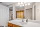 Bathroom featuring a vanity, mirror, and shower at 101 Kenmare Row, Tyrone, GA 30290