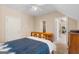 A bedroom featuring a wooden bed frame at 101 Kenmare Row, Tyrone, GA 30290
