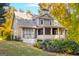 A multi-story home featuring an outdoor porch at 101 Kenmare Row, Tyrone, GA 30290