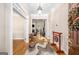Elegant foyer with hardwood floors, high ceilings, and decorative rug leading into the home at 101 Kenmare Row, Tyrone, GA 30290