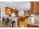 Spacious kitchen with granite countertops, island and wooden cabinetry at 101 Kenmare Row, Tyrone, GA 30290