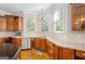 Well-lit kitchen featuring wood floors, stainless steel appliances, and granite countertops at 101 Kenmare Row, Tyrone, GA 30290