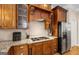 Close-up of kitchen with granite countertops, stainless steel appliances, and custom cabinetry at 101 Kenmare Row, Tyrone, GA 30290