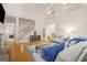 Bright living room with hardwood floors, high ceilings, staircase and comfortable sofas at 101 Kenmare Row, Tyrone, GA 30290