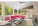 Outdoor porch featuring a stone fireplace and patio furniture at 101 Kenmare Row, Tyrone, GA 30290