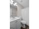 Standard bathroom features, toilet, shower, sink and mirror at 3645 Fay Dr, Rex, GA 30273