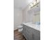 This is a bathroom with marble countertops, toilet, sink and mirror at 3645 Fay Dr, Rex, GA 30273