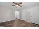 The bedroom showcases hardwood floors, a ceiling fan and two closet doors offering ample storage space at 3645 Fay Dr, Rex, GA 30273