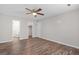 This is a bedroom that is a walk in to the bathroom and closet. Includes wood-look flooring and fan at 3645 Fay Dr, Rex, GA 30273