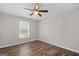 This is a bedroom with wood-look flooring and ceiling fan at 3645 Fay Dr, Rex, GA 30273