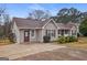 Charming single-story home with neutral siding, red shutters, a brown roof, and a long driveway at 3645 Fay Dr, Rex, GA 30273