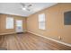 This inviting living room boasts a door leading to the outside, hardwood floors and two bright, sunlit windows at 3645 Fay Dr, Rex, GA 30273