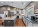 Spacious kitchen featuring a large island, stainless steel appliances, and light-colored cabinets at 283 Shoemake Rd, Carrollton, GA 30116