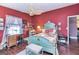 Inviting bedroom featuring a bed, a ceiling fan and ample natural light at 86 Victoria Dr, Moreland, GA 30259