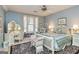 Comfortable bedroom featuring a ceiling fan, a writing desk, and natural light at 86 Victoria Dr, Moreland, GA 30259
