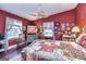 Comfortable bedroom with hardwood floors, ceiling fan, and ample natural light at 86 Victoria Dr, Moreland, GA 30259