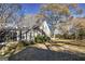 Charming home with gray siding, black shutters, and a well-maintained lawn at 86 Victoria Dr, Moreland, GA 30259