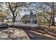 Charming two-story home featuring unique architecture and a inviting front porch at 86 Victoria Dr, Moreland, GA 30259