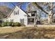 Charming two-story home featuring a welcoming front porch and fenced yard at 86 Victoria Dr, Moreland, GA 30259
