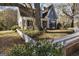 Charming two-story home featuring unique architecture with a big tree in the front yard at 86 Victoria Dr, Moreland, GA 30259