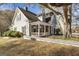 Charming two-story home featuring a welcoming front porch and fenced yard at 86 Victoria Dr, Moreland, GA 30259