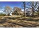 Quaint home with a sprawling yard surrounded by mature trees at 86 Victoria Dr, Moreland, GA 30259