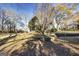 Beautifully landscaped yard with a charming two-story home and mature trees at 86 Victoria Dr, Moreland, GA 30259