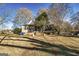 Charming home with a spacious front yard and mature trees at 86 Victoria Dr, Moreland, GA 30259