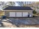 Spacious three-car garage with ample parking and storage space on a concrete pad at 86 Victoria Dr, Moreland, GA 30259