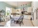 Open kitchen featuring white cabinets, granite countertops, and tile flooring at 86 Victoria Dr, Moreland, GA 30259